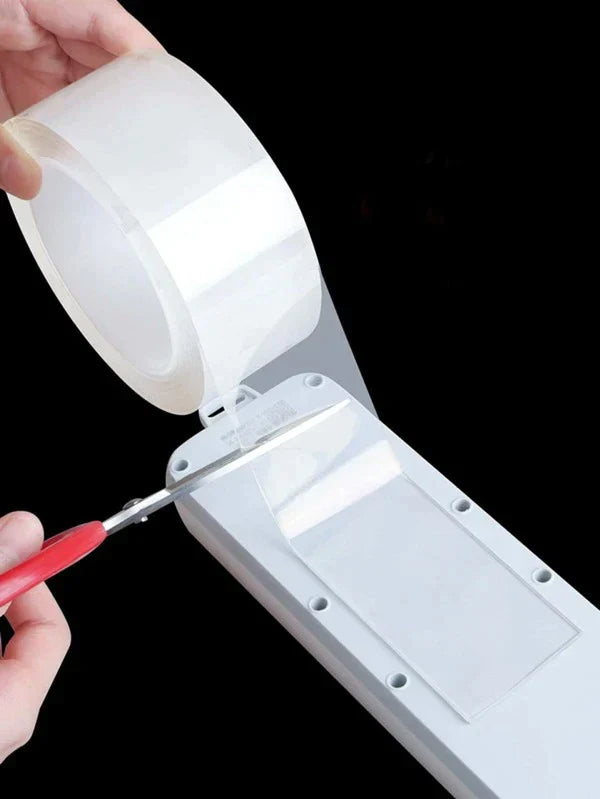 Ignisio double-sided reusable tape shown on a hand, featuring clear, flexible adhesive strips for versatile mounting and bonding.