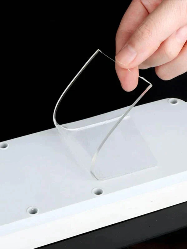 Double-sided reusable tape by Ignisio showing the adhesive sides and roll for versatile mounting and sticking applications.