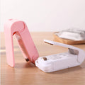 Ignisio mini heat sealer with black handle and compact design for sealing plastic bags and food storage.