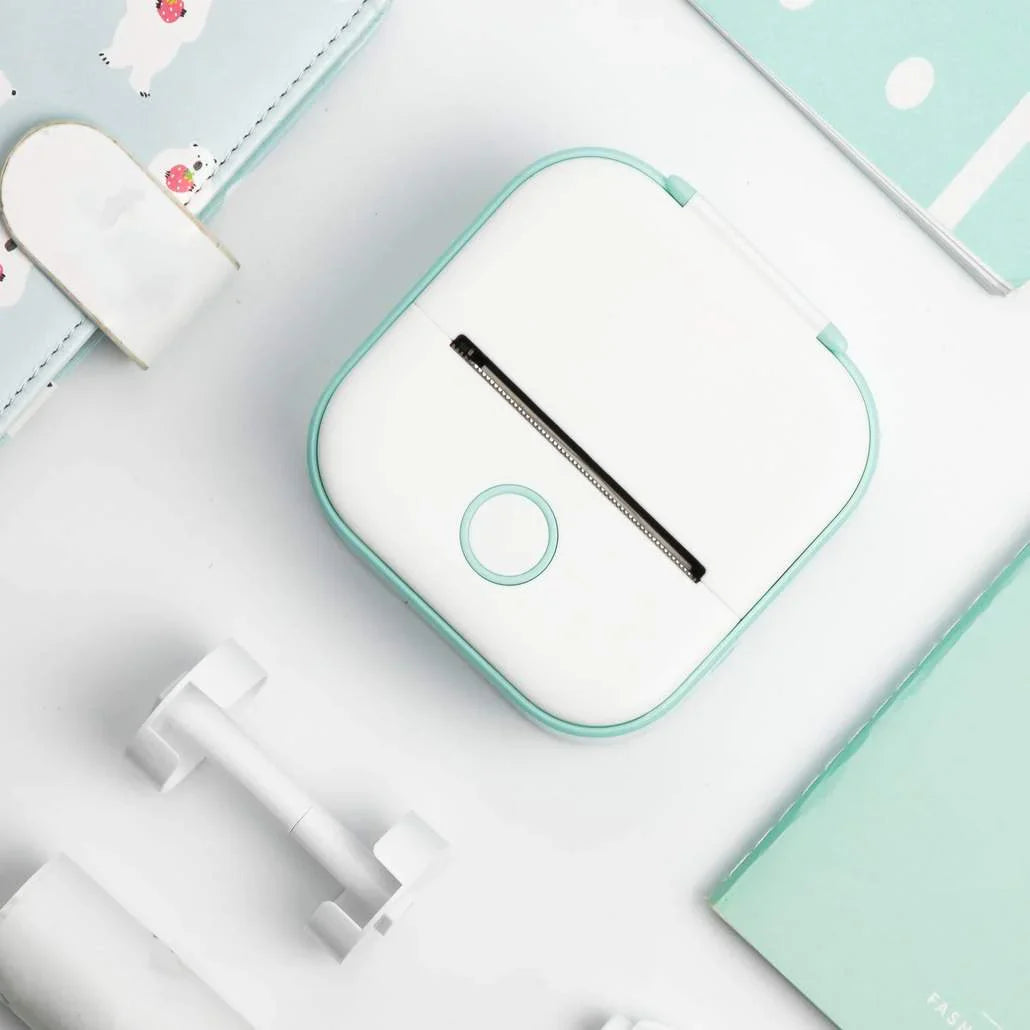 Beckett portable printer with compact design, showing a sleek black device and paper output on a plain background.