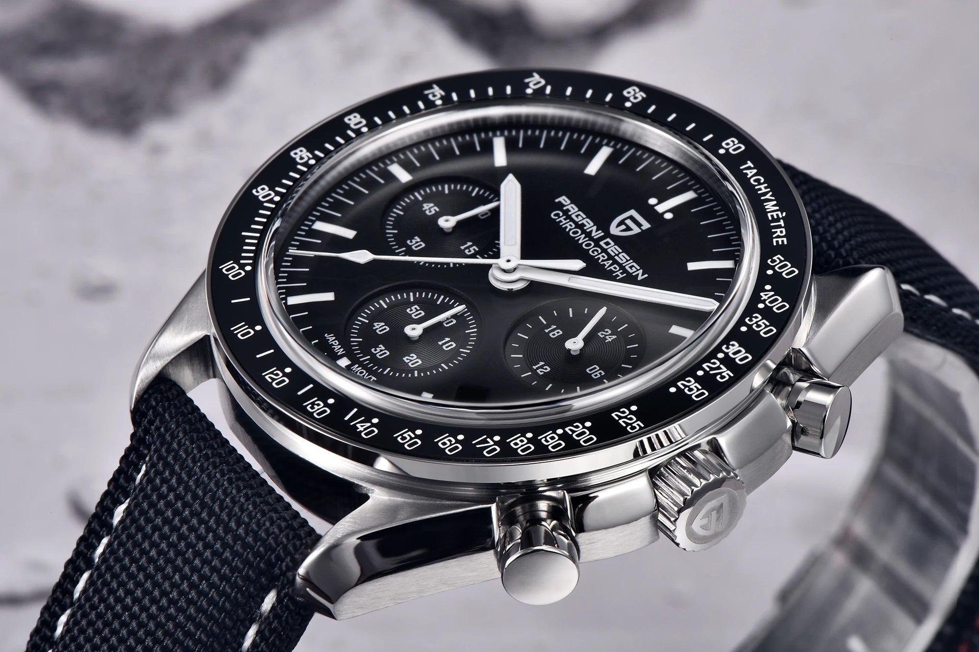 Home Sweet Home Pagani Design Moonwatch Chronograph watch with black dial, stainless steel band, and detailed subdials.