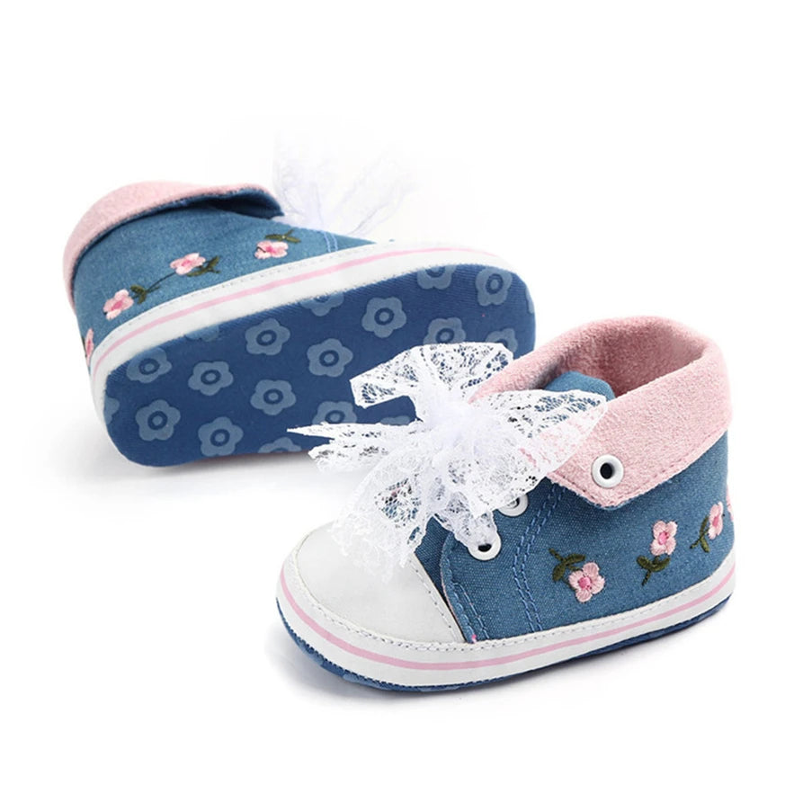 Baby girl floral embroidered first walker shoes by Home Sweet Home, soft sole crib shoes with colorful flower details and gentle design.