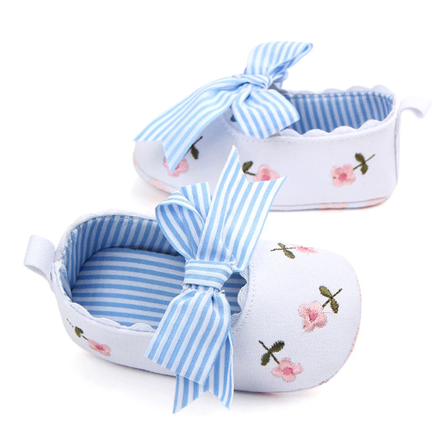 Baby girl floral embroidered first walker shoes with soft soles, crib shoes from Home Sweet Home, featuring delicate floral embroidery.