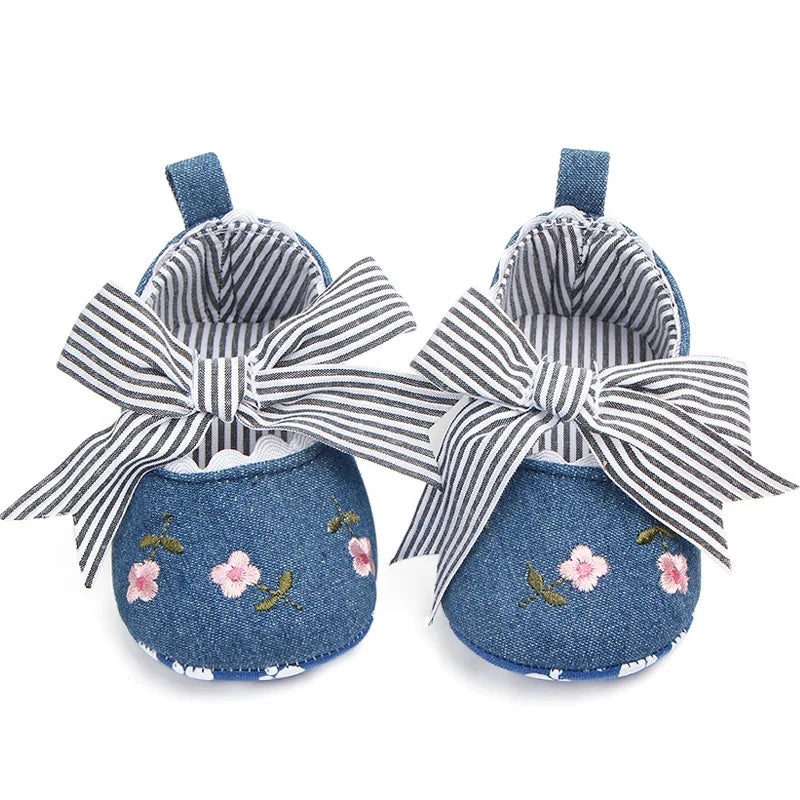 Baby girl floral embroidered first walker shoes by Home Sweet Home, soft sole crib shoes with colorful floral details.
