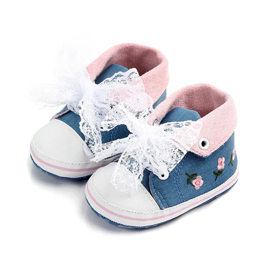 Baby girl floral embroidered soft sole crib shoes by Home Sweet Home, featuring delicate flower designs and comfortable first walker style.