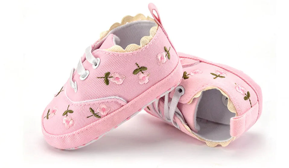 Baby girl floral embroidered first walker shoes by Home Sweet Home, soft sole crib shoes with colorful flower details.