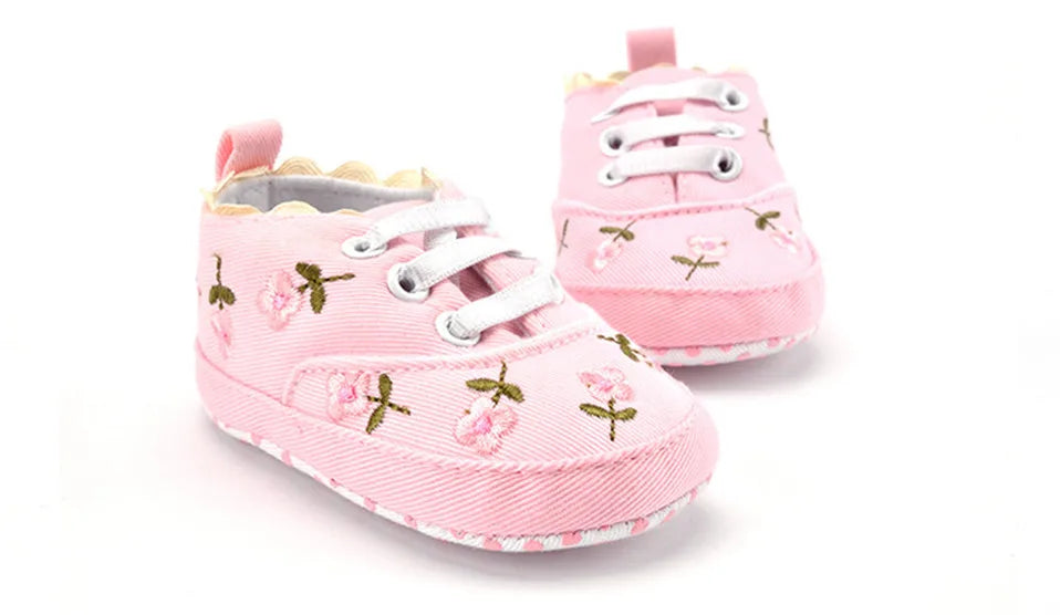 Baby girl floral embroidered first walker shoes from Home Sweet Home with soft soles and colorful flower designs.
