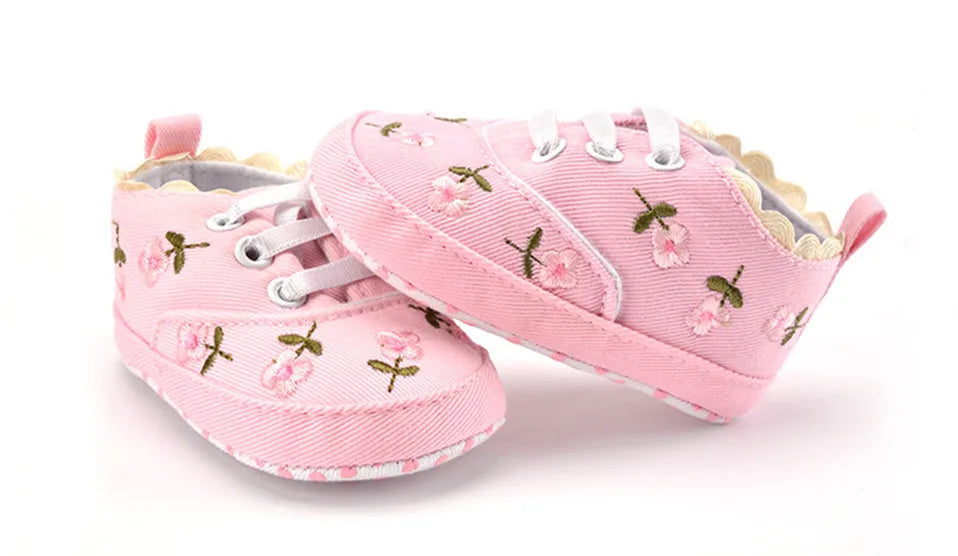 Baby girl floral embroidered first walker shoes by Home Sweet Home, soft sole crib shoes with colorful floral details.