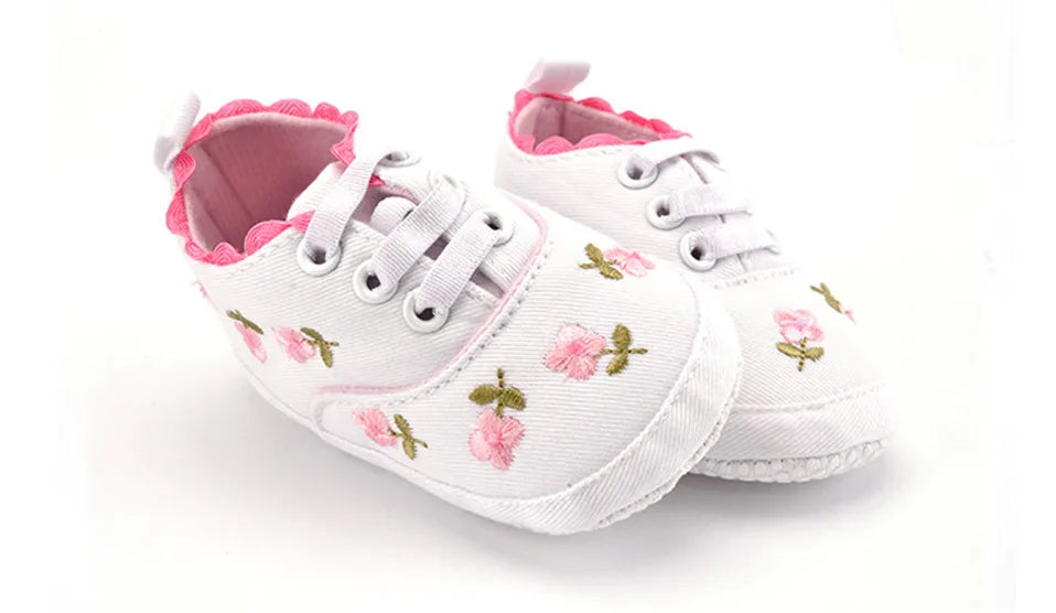 Home Sweet Home baby girl floral embroidered first walker shoes with soft soles and adorable crib shoe design.