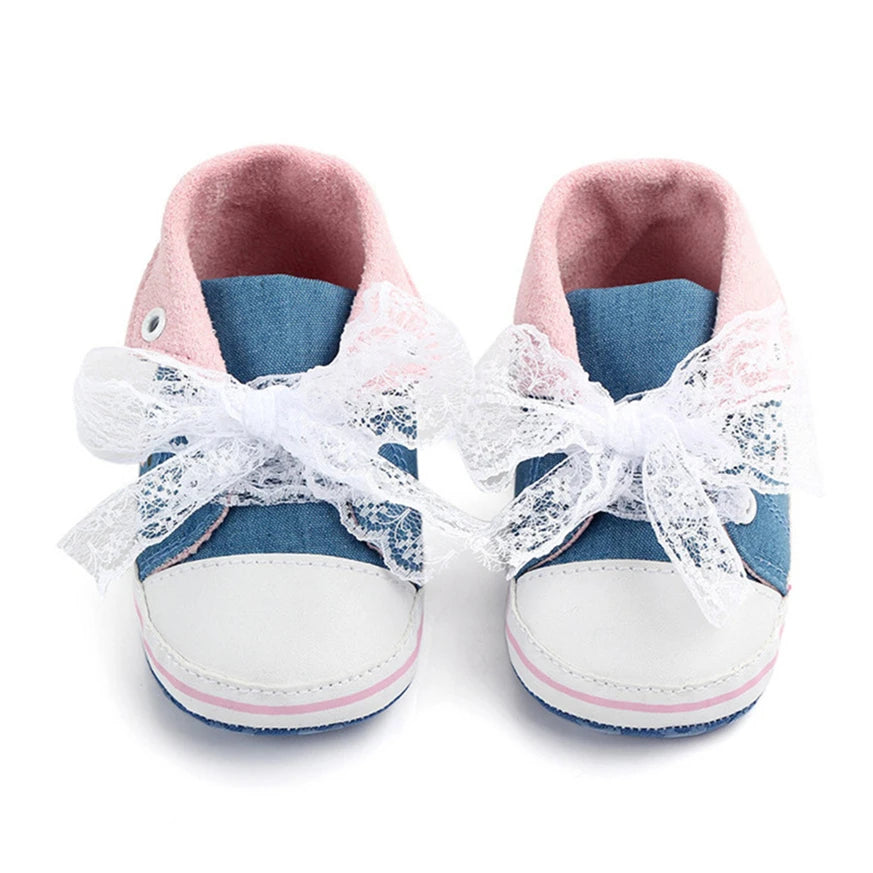 Baby girl floral embroidered first walker shoes by Home Sweet Home with soft soles and colorful flower details.