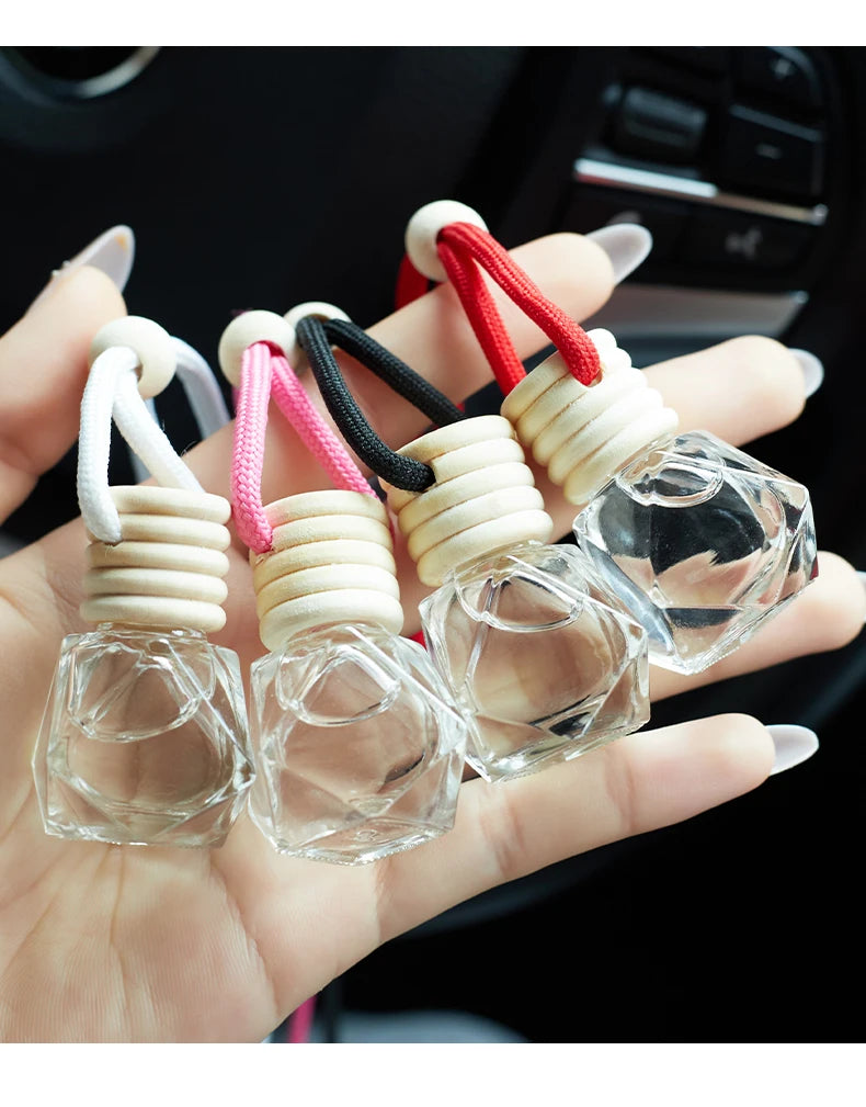 Home Sweet Home car air freshener perfume hanging with a decorative design, emitting a fresh, floral scent.