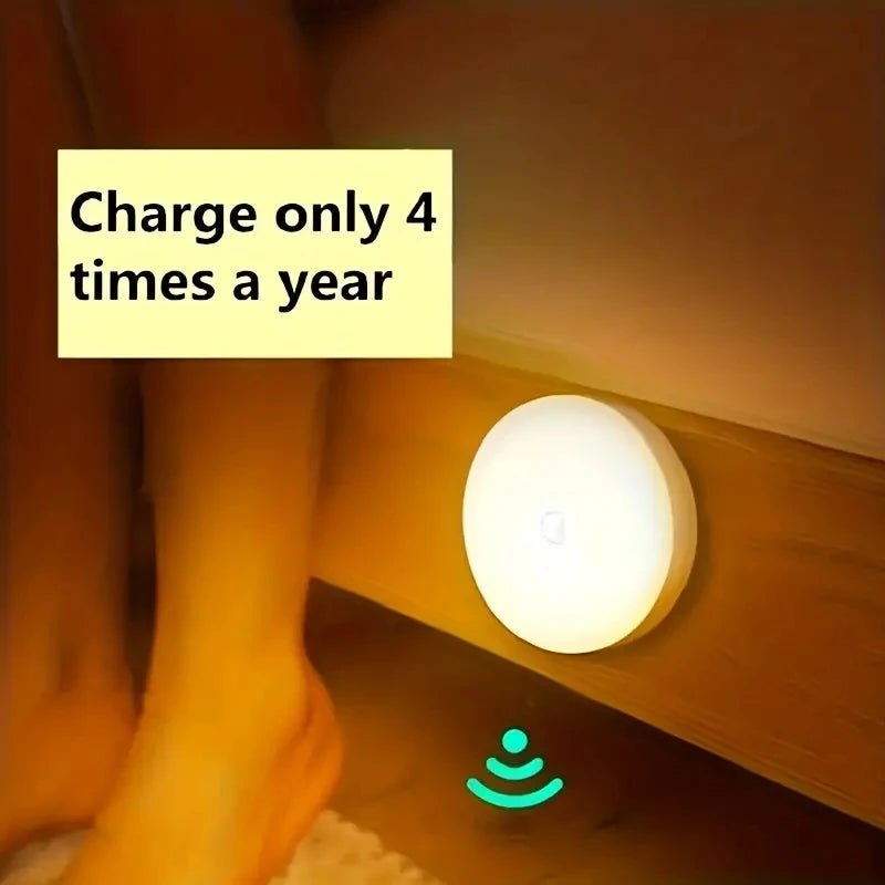 Home Sweet Home motion sensor LED night light illuminating a dark hallway with a sleek, compact design for energy-efficient lighting.