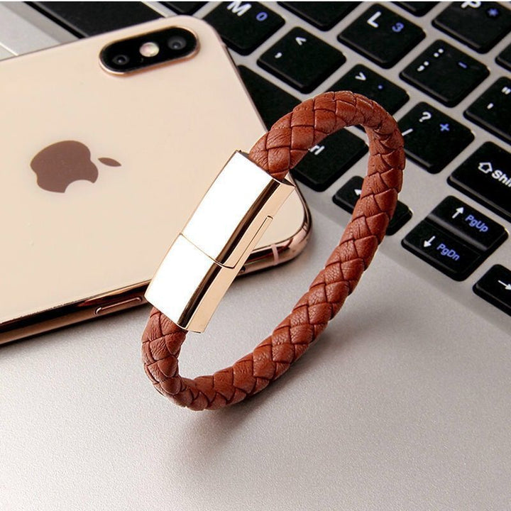 Beckett charging bracelet with sleek black band and integrated charging port, designed for stylish, portable device charging.