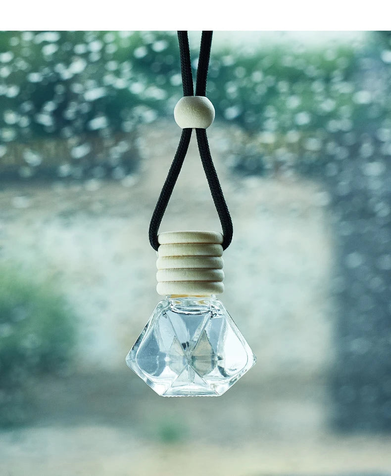 Home Sweet Home car air freshener perfume hanging on a car rearview mirror with a decorative design and fresh scent.