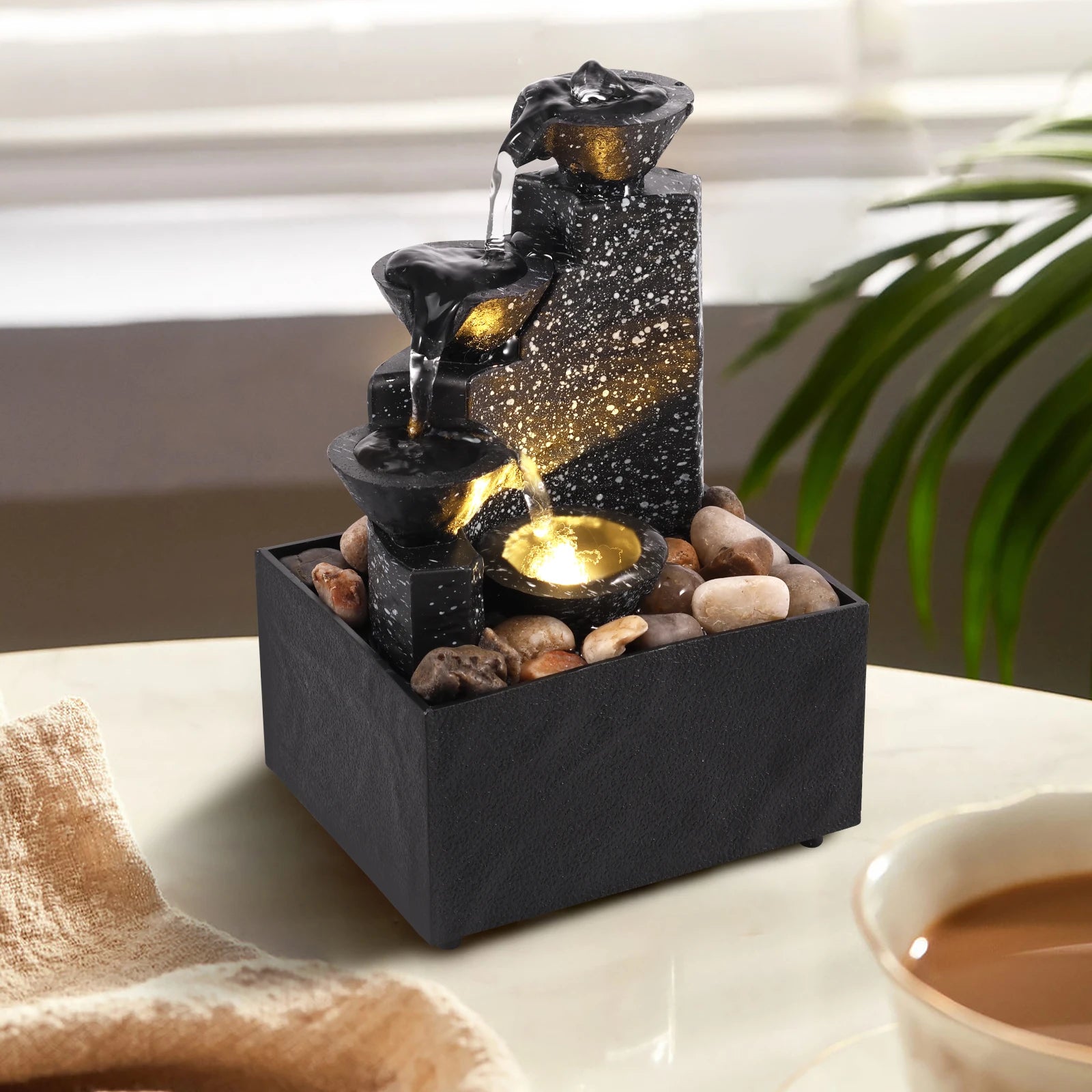 Home Sweet Home tabletop waterfall fountain with soft LED lights, featuring flowing water and a sleek desktop water feature design.