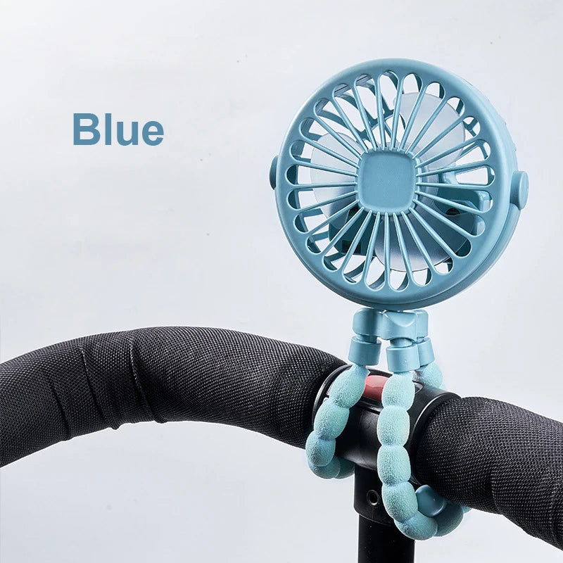 Home Sweet Home portable mini clip fan with USB rechargeability and 360° flexible tripod, shown clipped to a desk surface.