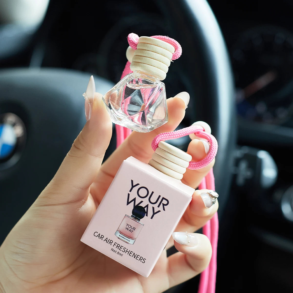 Home Sweet Home car air freshener perfume hanging with floral design and fresh scent, visible packaging and decorative elements.