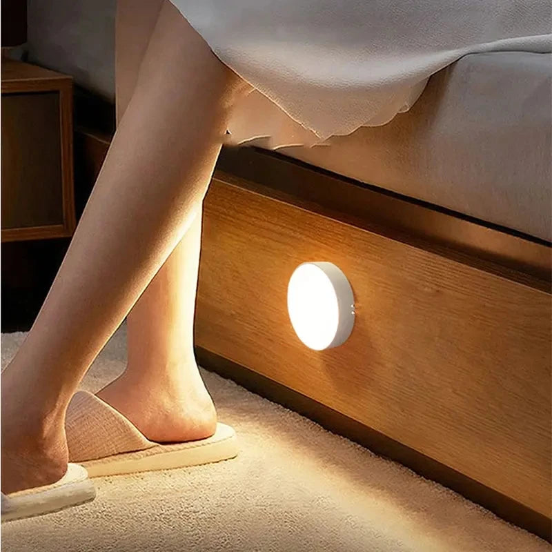 Home Sweet Home motion sensor LED night light illuminating a dark room with soft, energy-efficient light.