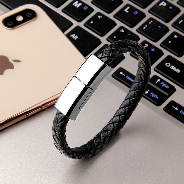 Beckett charging bracelet with sleek design and integrated charging port, displayed on a white background.