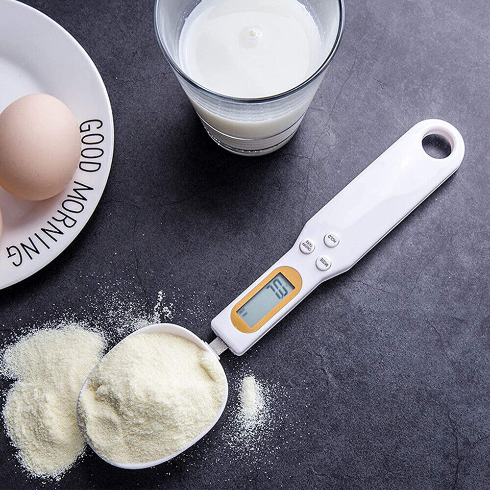 Beckett LCD digital kitchen scale with spoon for precise measurement of ingredients in a modern kitchen setting.