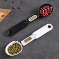 Beckett LCD digital kitchen scale with integrated spoon for precise weight measurements in a modern kitchen setting